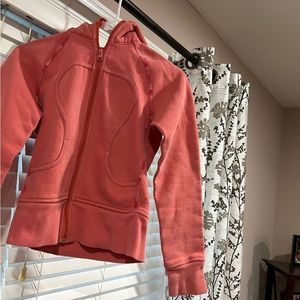 Salmon color, used vintage Lululemon Full Zip Scuba size 2 but runs small